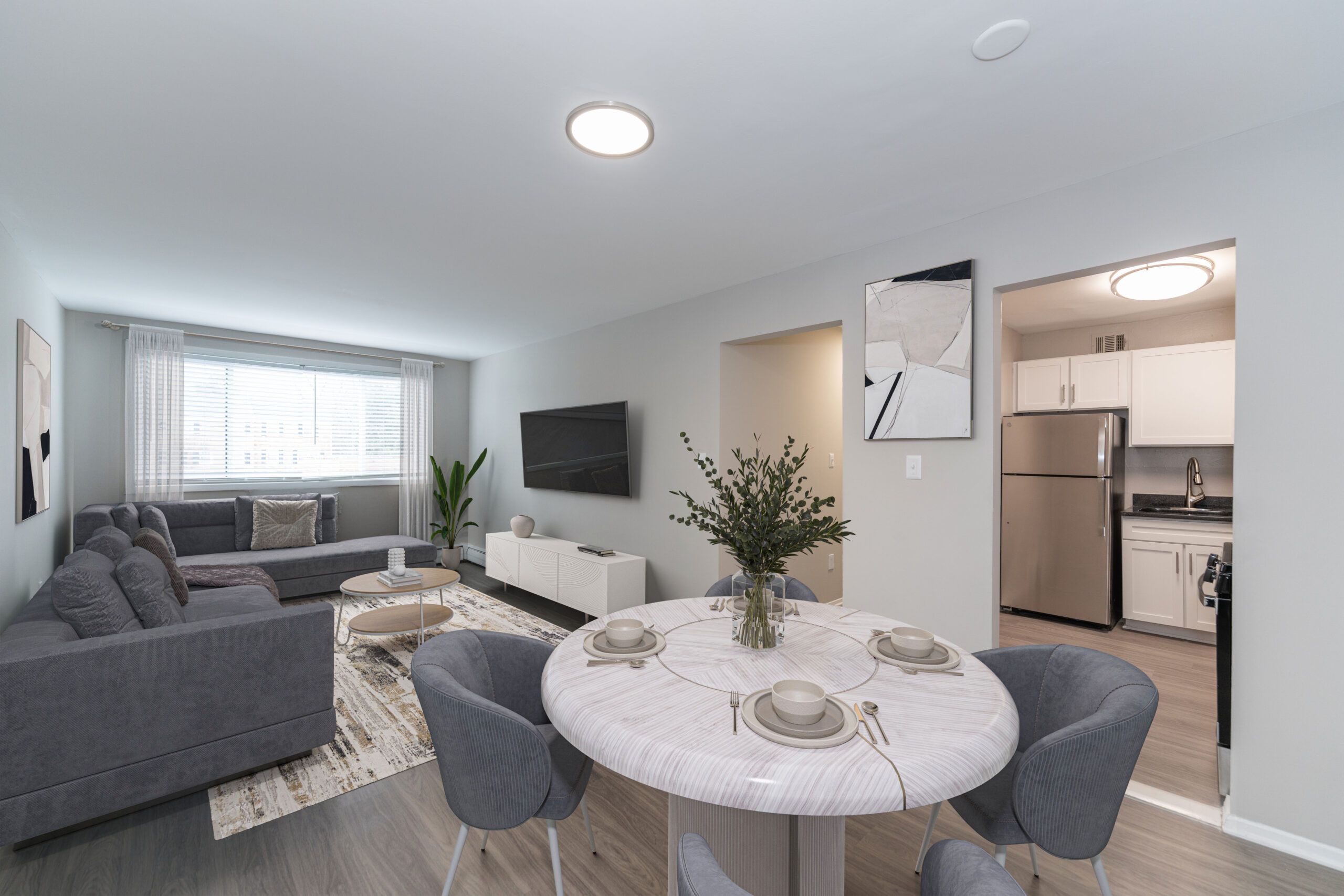 Mason Avenue kitchen with white cabinet tops, black counters and white appliances
